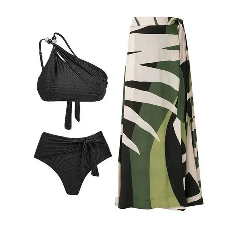 Women's brown push up high waist swimsuit with a split brief design and a sheer black chiffon dress overlay.