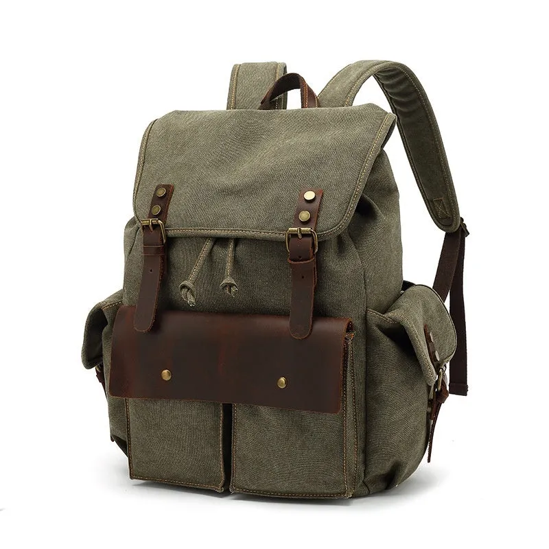 Retro canvas backpack in army green with antique bronze hardware showing dimensions and laptop compartment