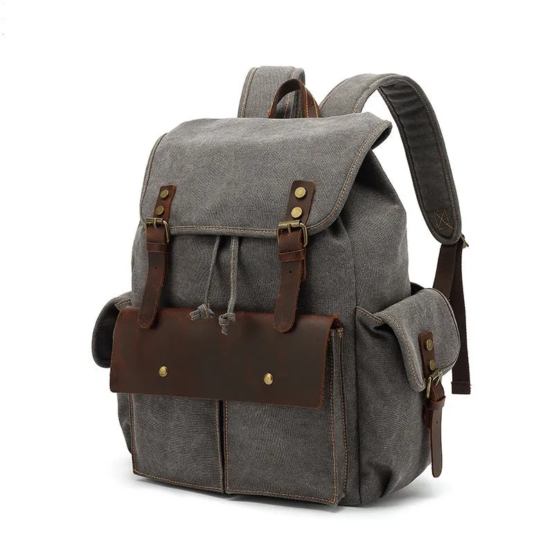 Retro canvas backpack in army green with antique bronze hardware showing dimensions and laptop compartment