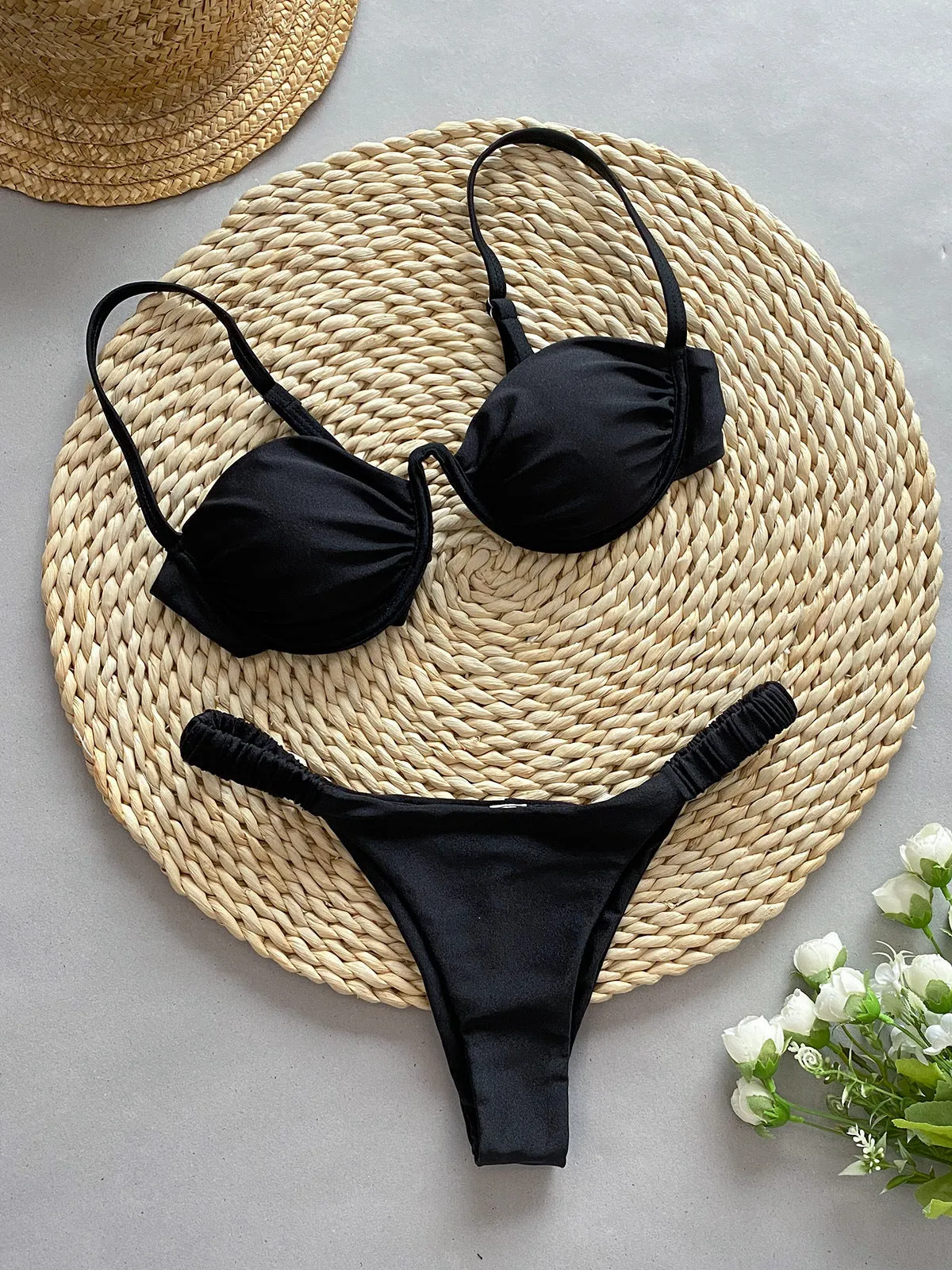Women's black underwire bikini swimsuit with briefs bottom on a mannequin