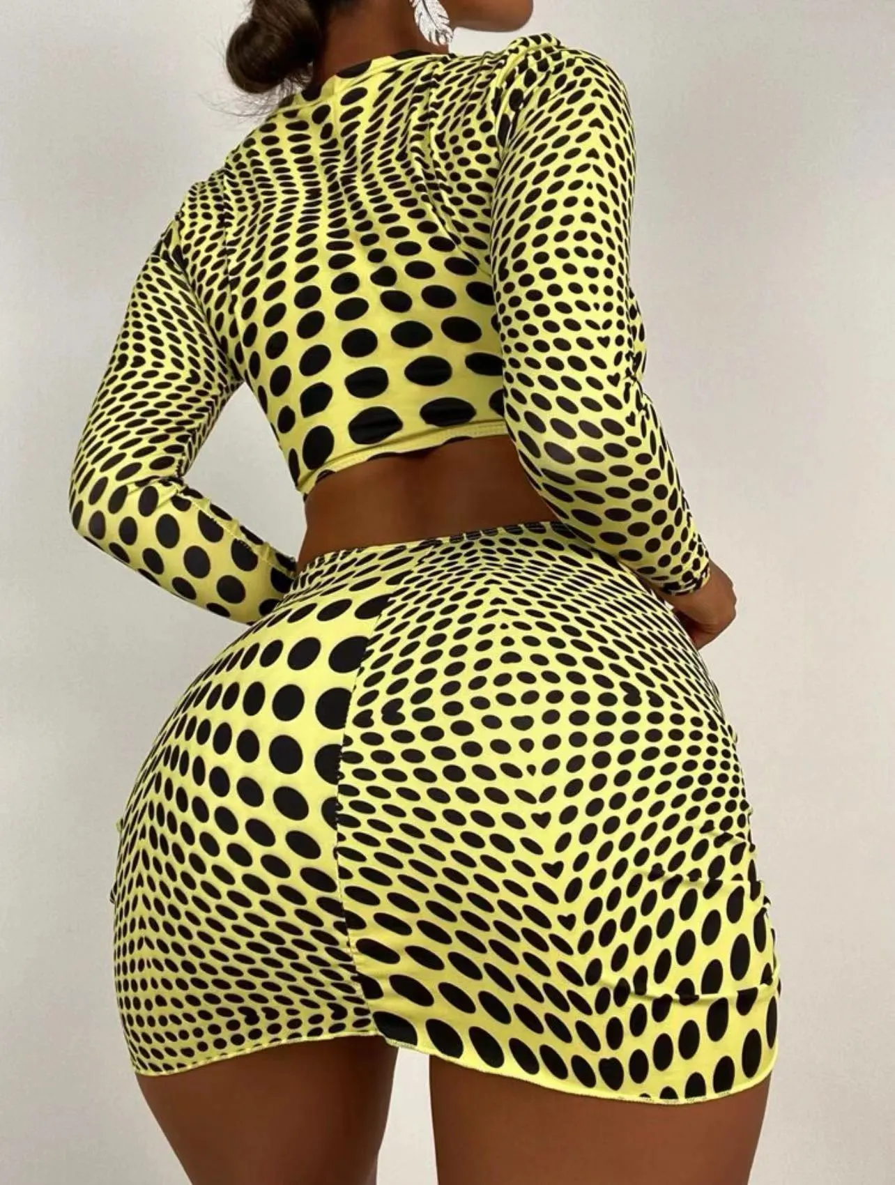 Women's green polka dot three-piece swimsuit set showing top, skirt and bra