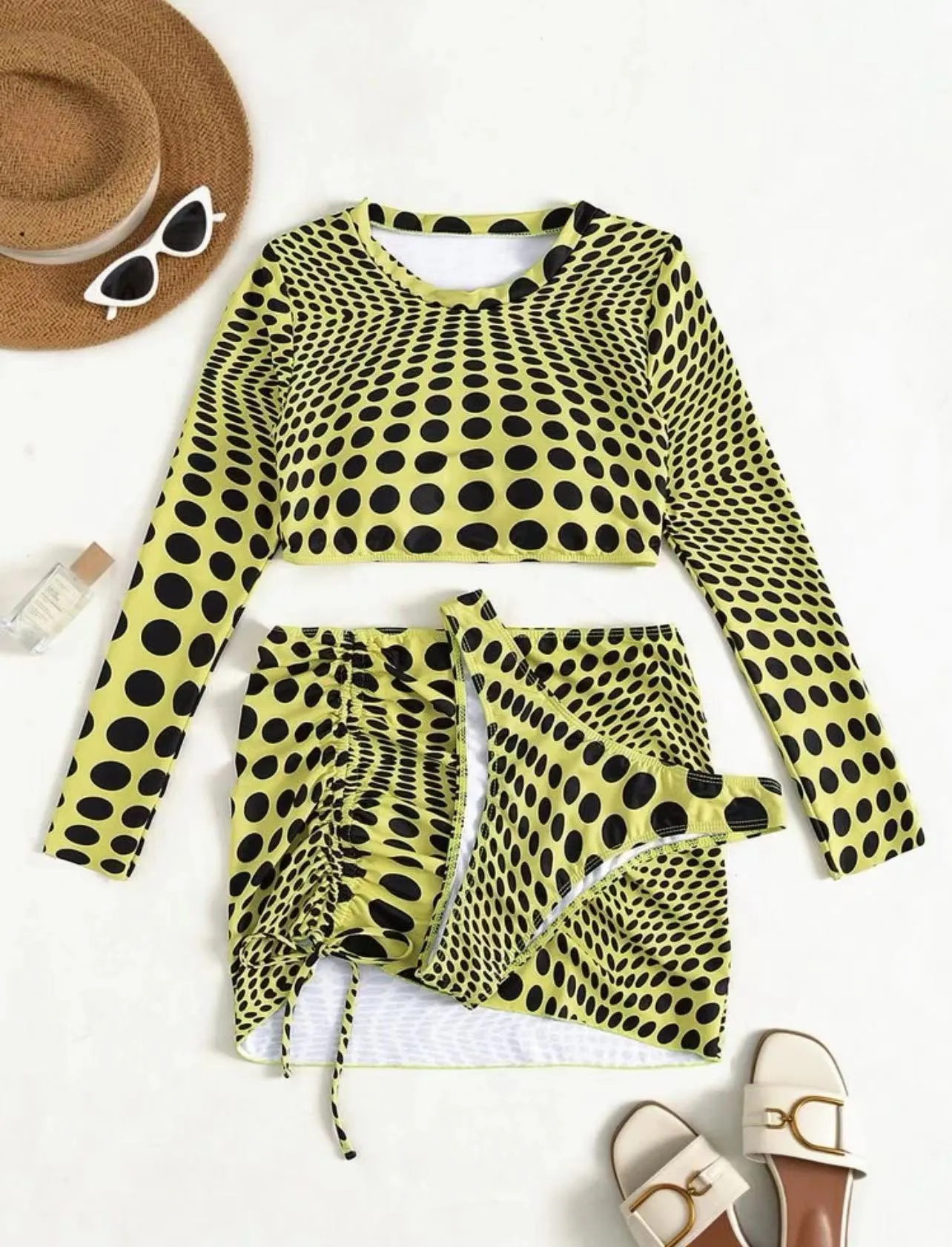 Women's green polka dot three-piece swimsuit set showing top, skirt and bra