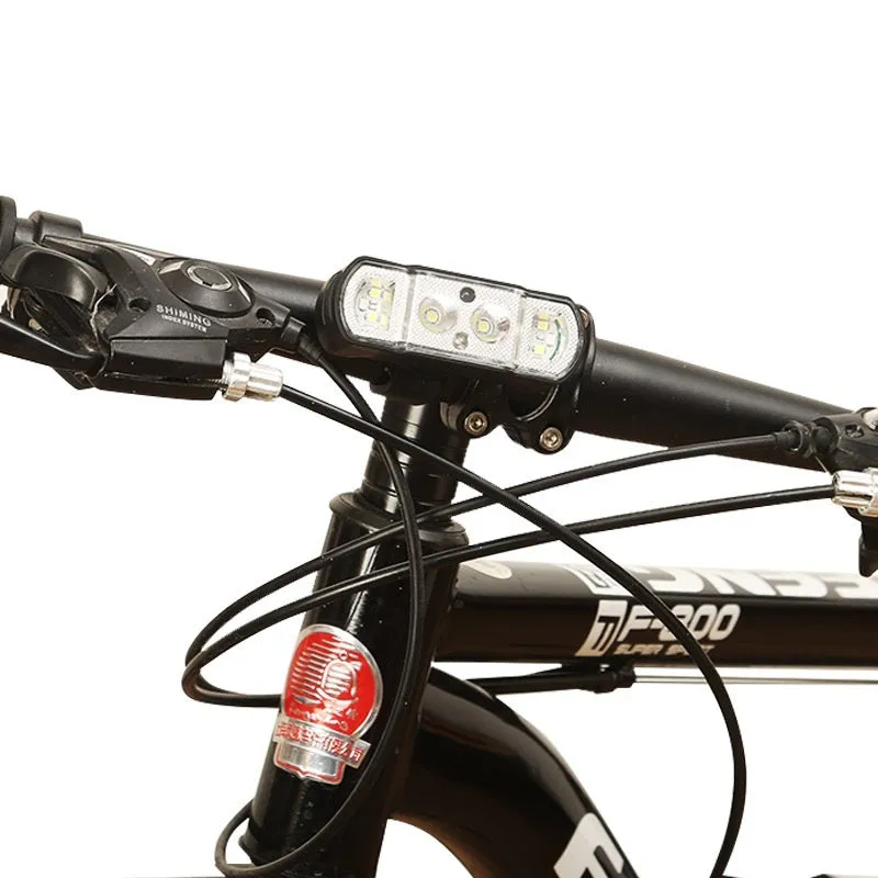 Black bicycle headlight with 350 lumen LED and removable 18650 battery mounted on handlebars