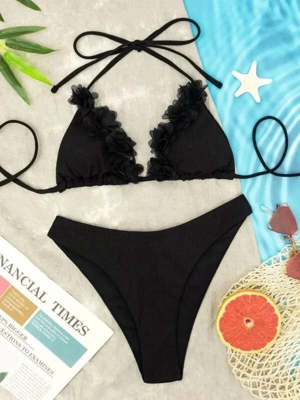 Black women's two-piece swimsuit set with gathered design, featuring a top and shorts.