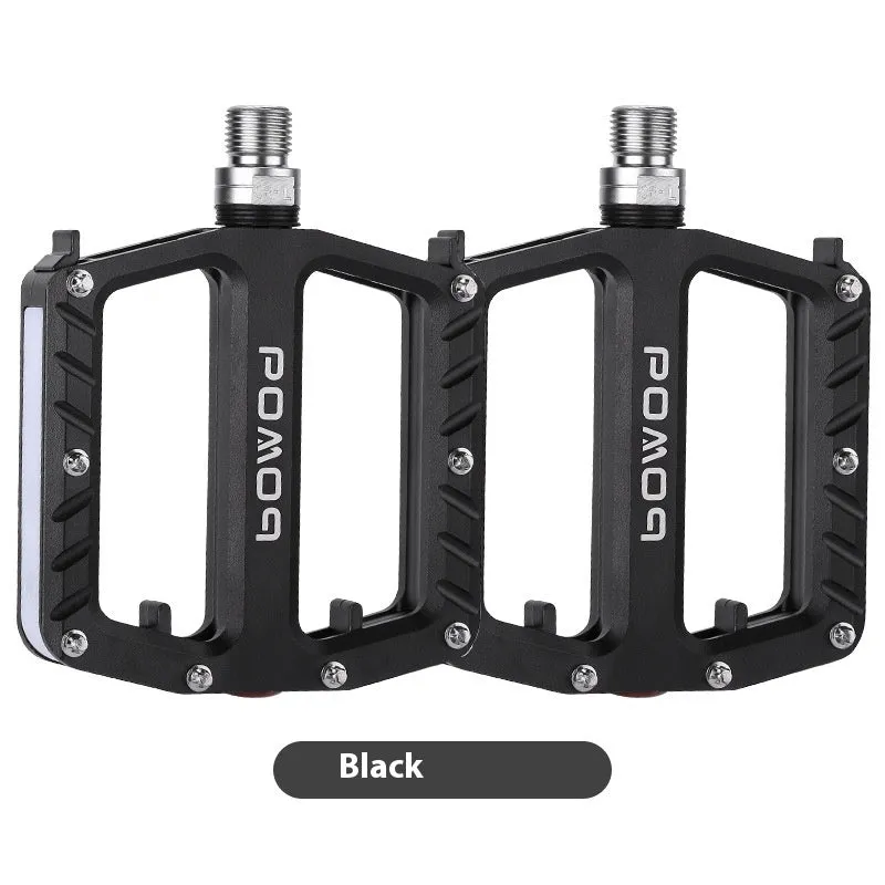 Aluminium alloy bicycle pedals with built-in 710LED lights in black, gold, purple, red, and titanium colour options.