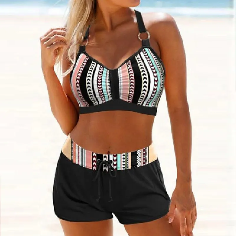 Women's printed two-piece polyester bikini swimsuit on a white background.