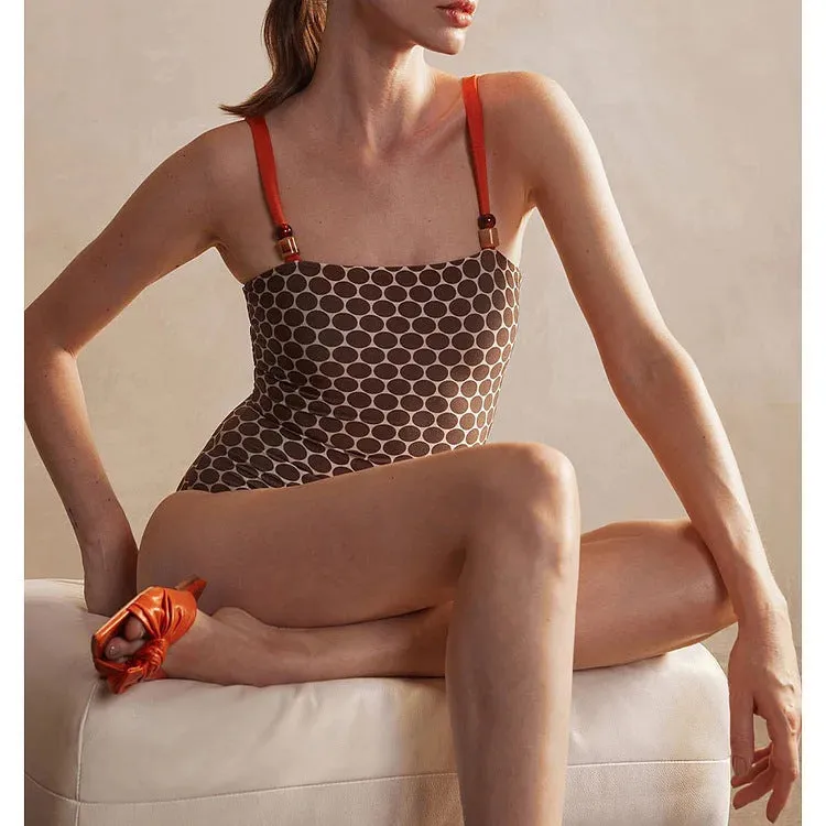 Women's printed dot pattern one-piece swimsuit with matching wrap skirt