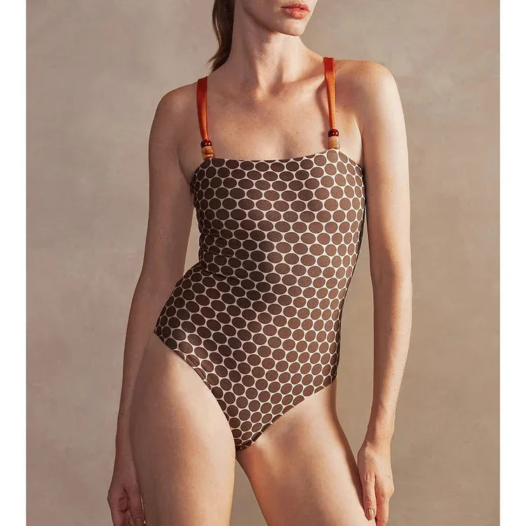 Women's printed dot pattern one-piece swimsuit with matching wrap skirt