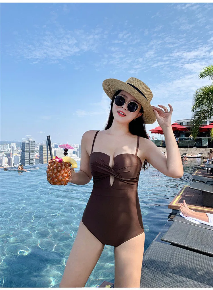 Brown women's one-piece swimsuit with spaghetti straps and push-up bust on a mannequin.
