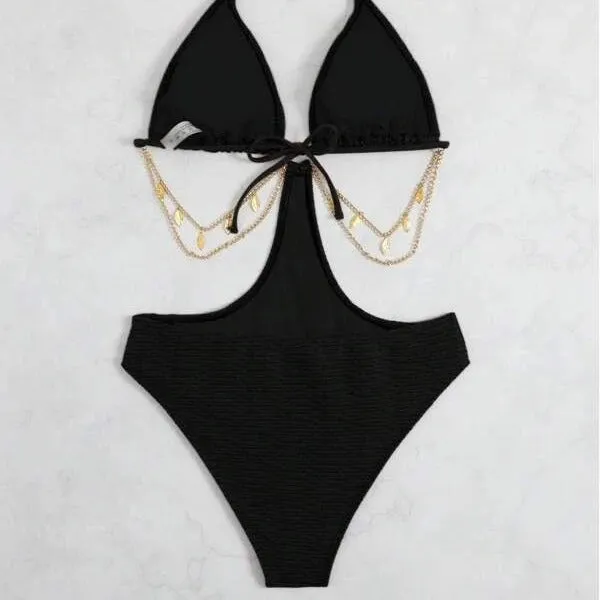 Women's black bikini swimsuit with chain detail on a mannequin.