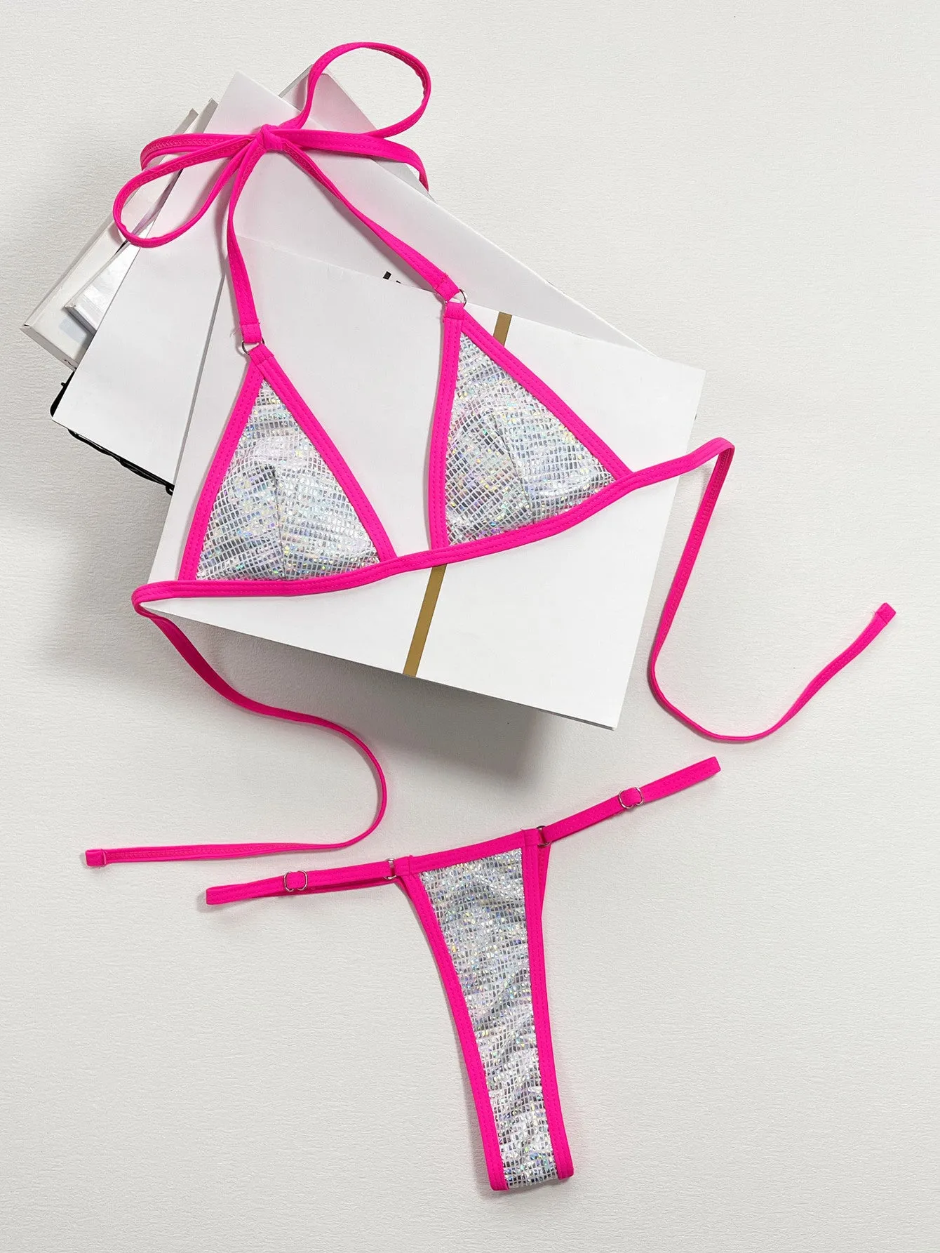 Silver women's split triangle bag bikini top on a white background.