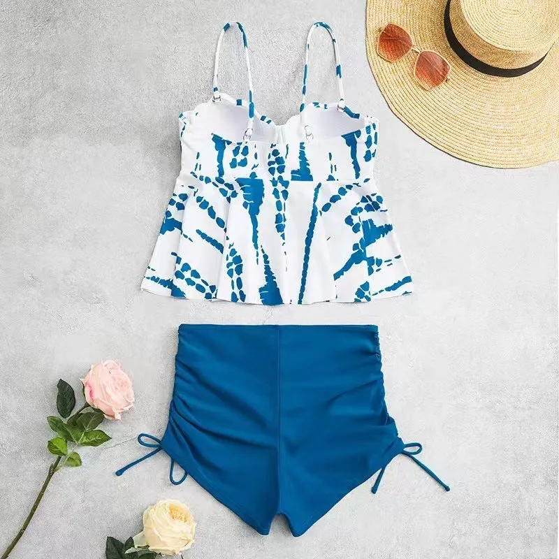 Women's geometric print split bikini swimsuit in blue, shown as a top and shorts set.