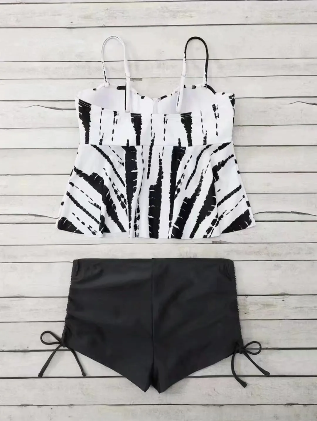 Women's geometric print split bikini swimsuit in blue, shown as a top and shorts set.