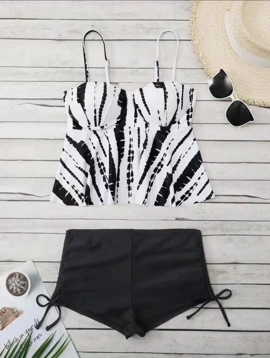 Women's geometric print split bikini swimsuit in blue, shown as a top and shorts set.