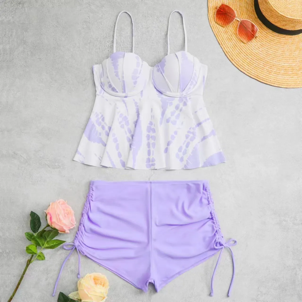 Women's geometric print split bikini swimsuit in blue, shown as a top and shorts set.