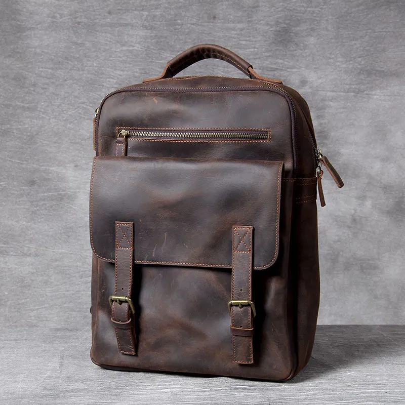 Dark coffee coloured handmade leather backpack with internal organiser compartments.