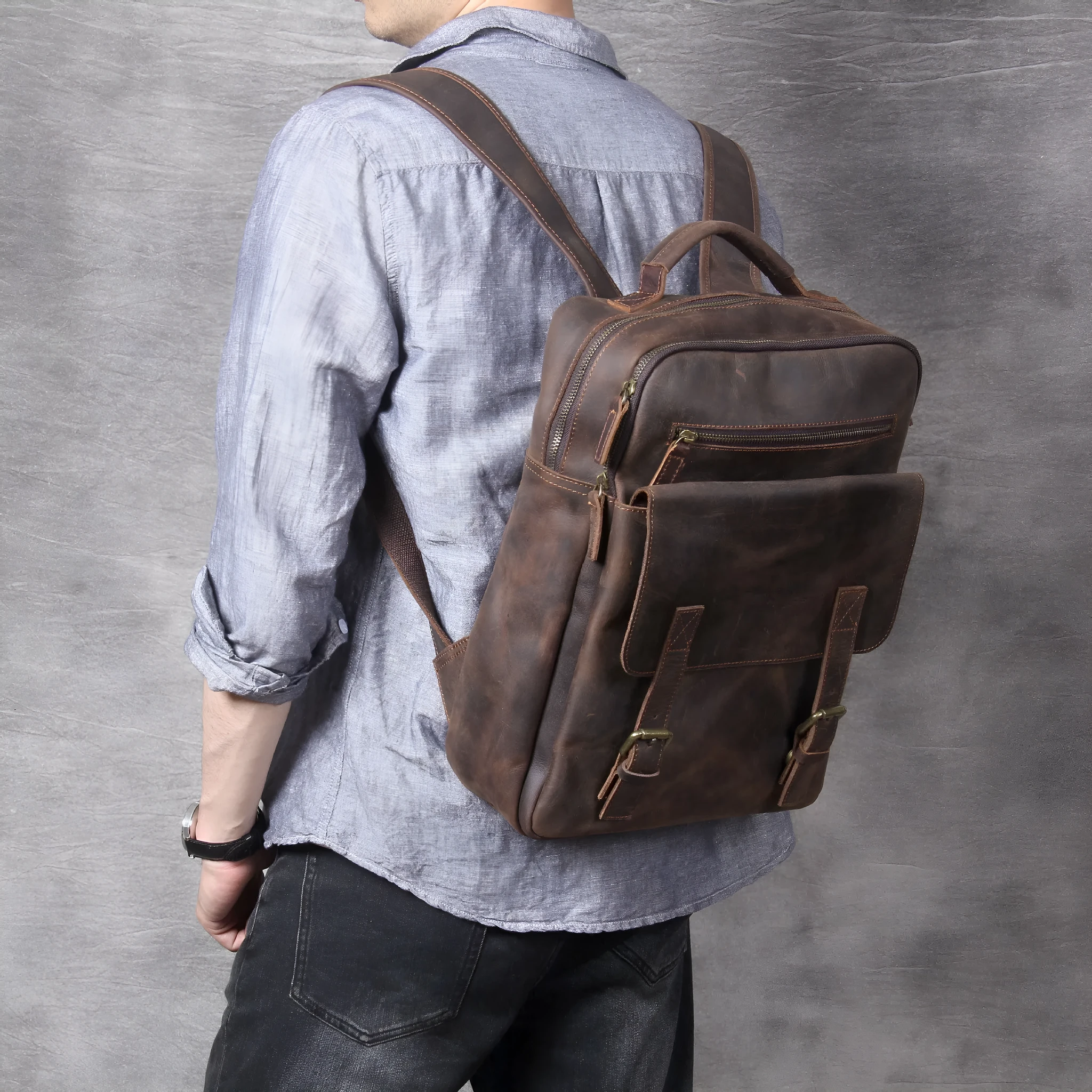 Dark coffee coloured handmade leather backpack with internal organiser compartments.