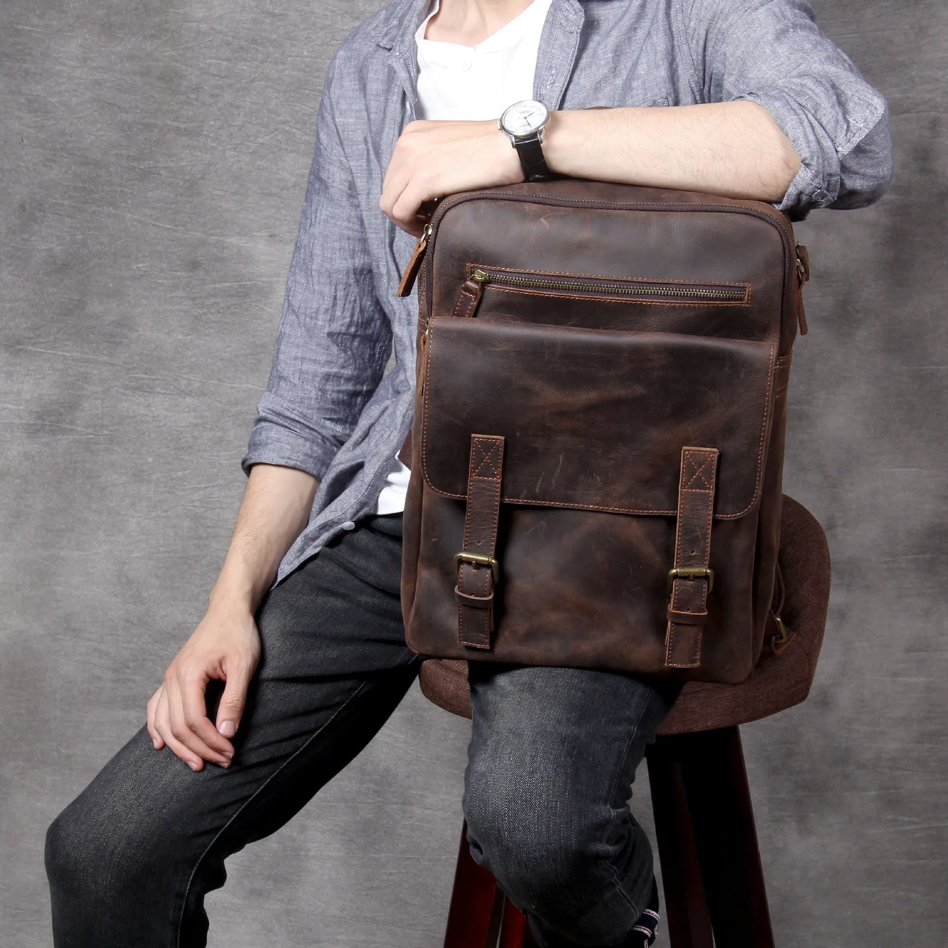 Dark coffee coloured handmade leather backpack with internal organiser compartments.