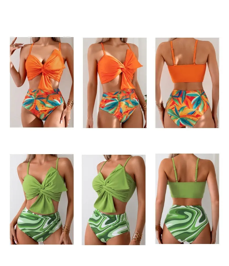 Women's orange nylon bikini set with large white bow print, showing top and swim trunks.