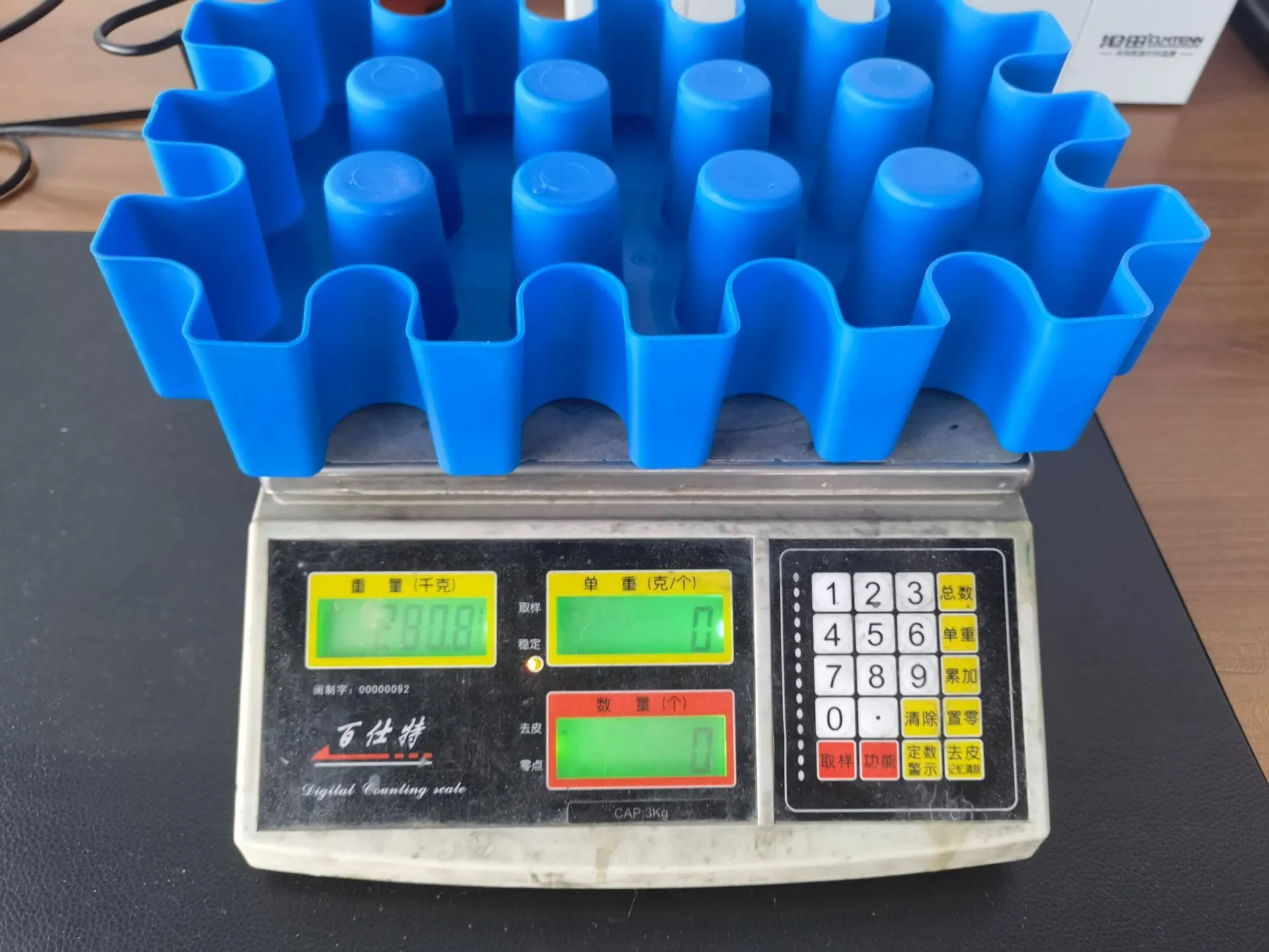 Blue plastic reusable ice block maker tray for outdoor coolers and camping.