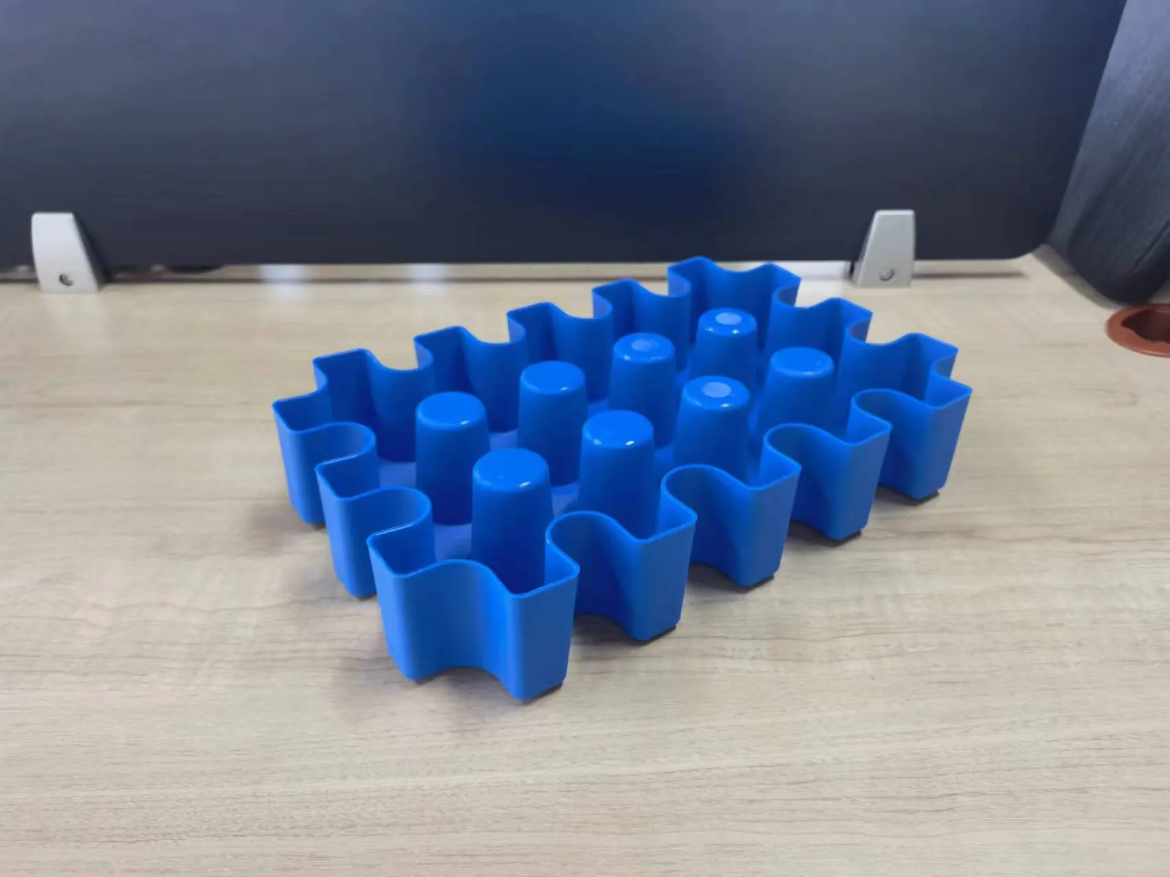 Blue plastic reusable ice block maker tray for outdoor coolers and camping.