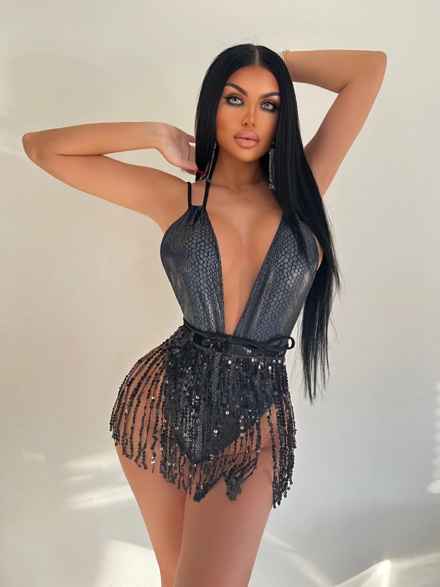 Backless one-piece swimsuit for women in gold, black, red, or white colours.