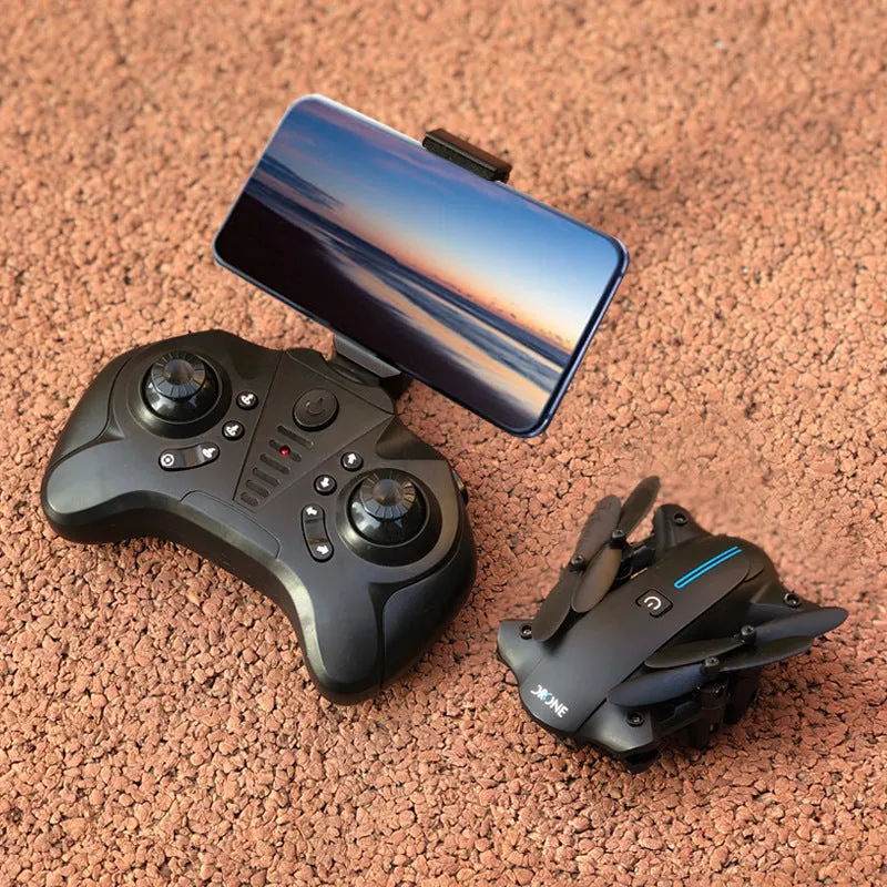 Mini folding drone with 4K camera in black, folded size 8x4x7cm, showing four rotors and remote controller