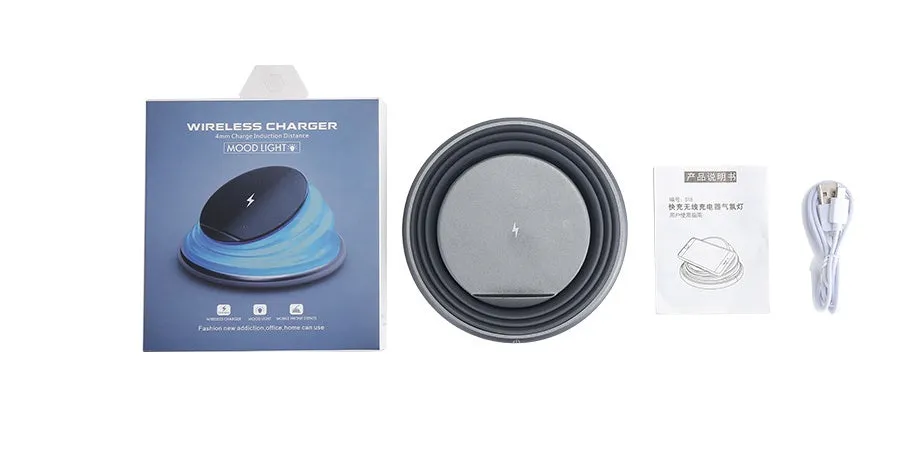 Grey wireless charger pad with silicone surface on a desk, 138mm square shape
