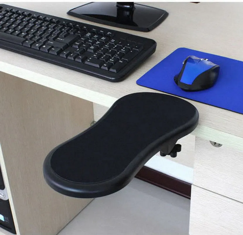 Black plastic rotating computer hand bracket wrist pad showing 180-degree adjustment on a desk.