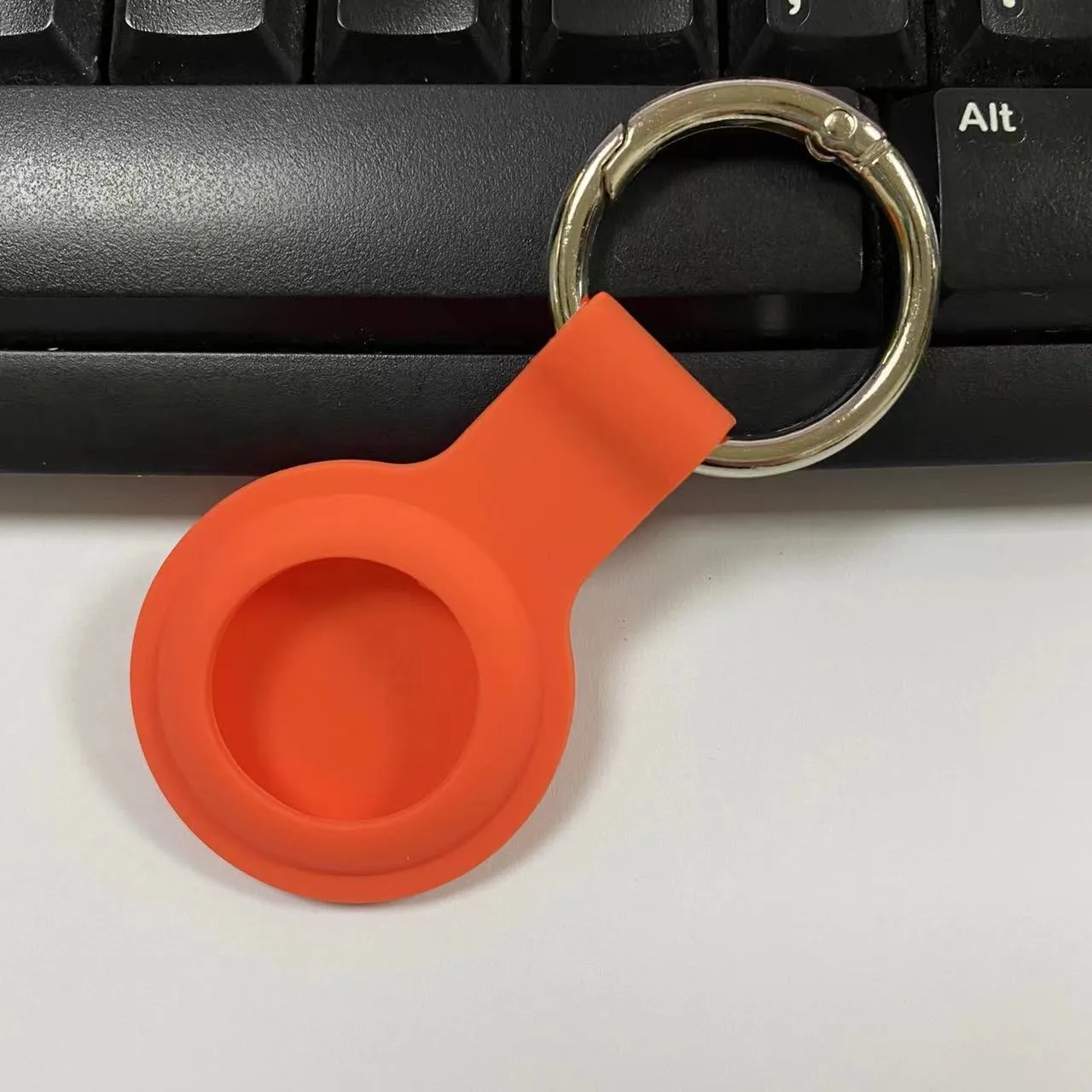 Silicone AirTag protective case with metal snap button in multiple colour options