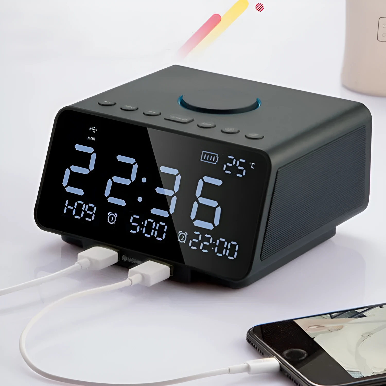 Black and white wireless alarm clock Bluetooth speaker with control buttons on top.