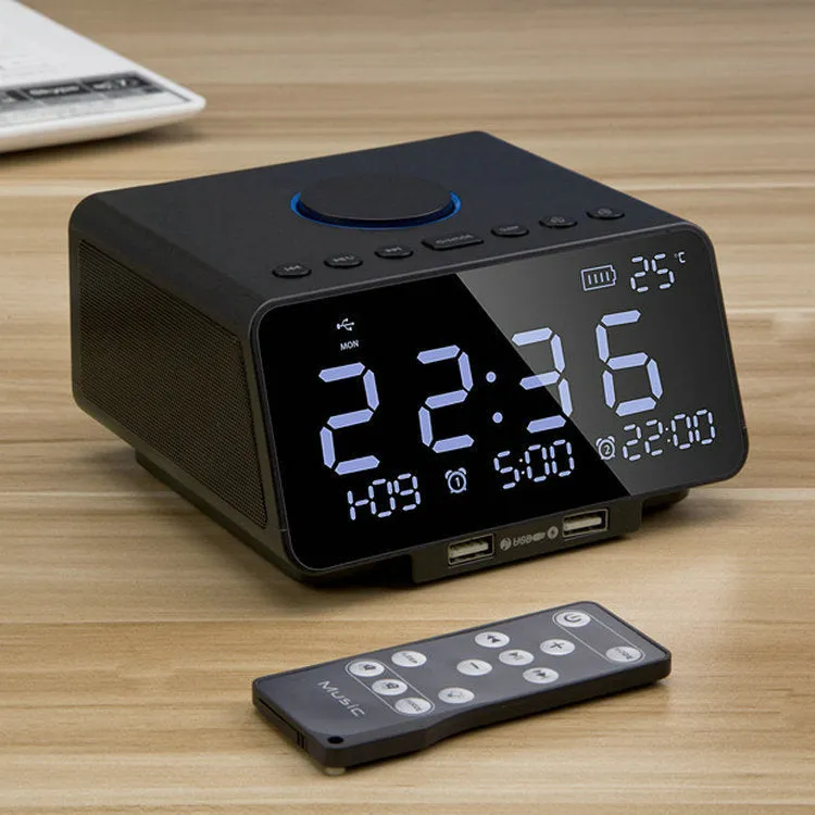 Black and white wireless alarm clock Bluetooth speaker with control buttons on top.