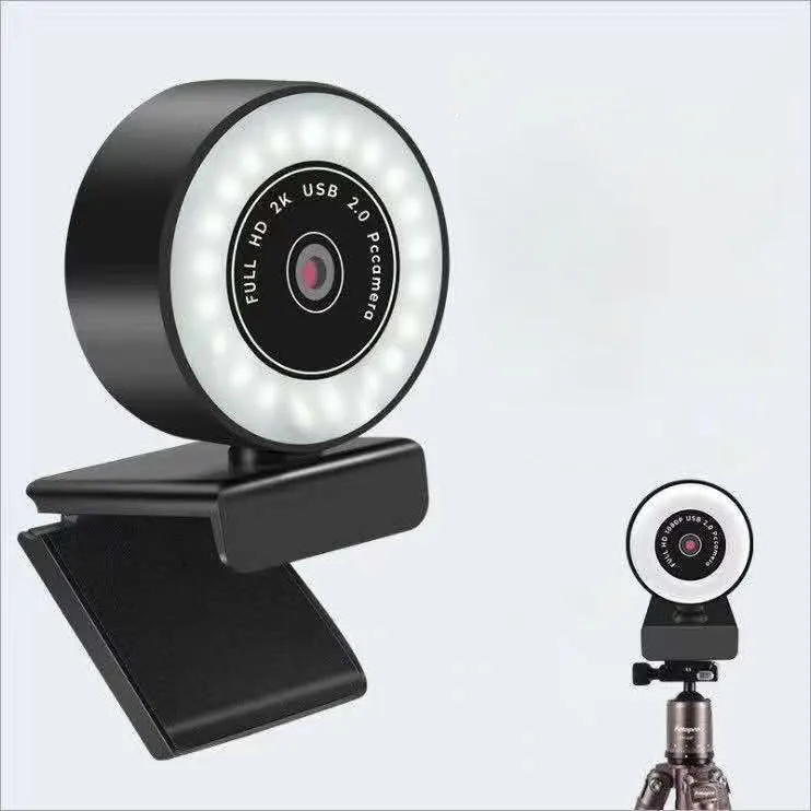 Black high-definition USB webcam with built-in fill light for video conferencing on a PC.
