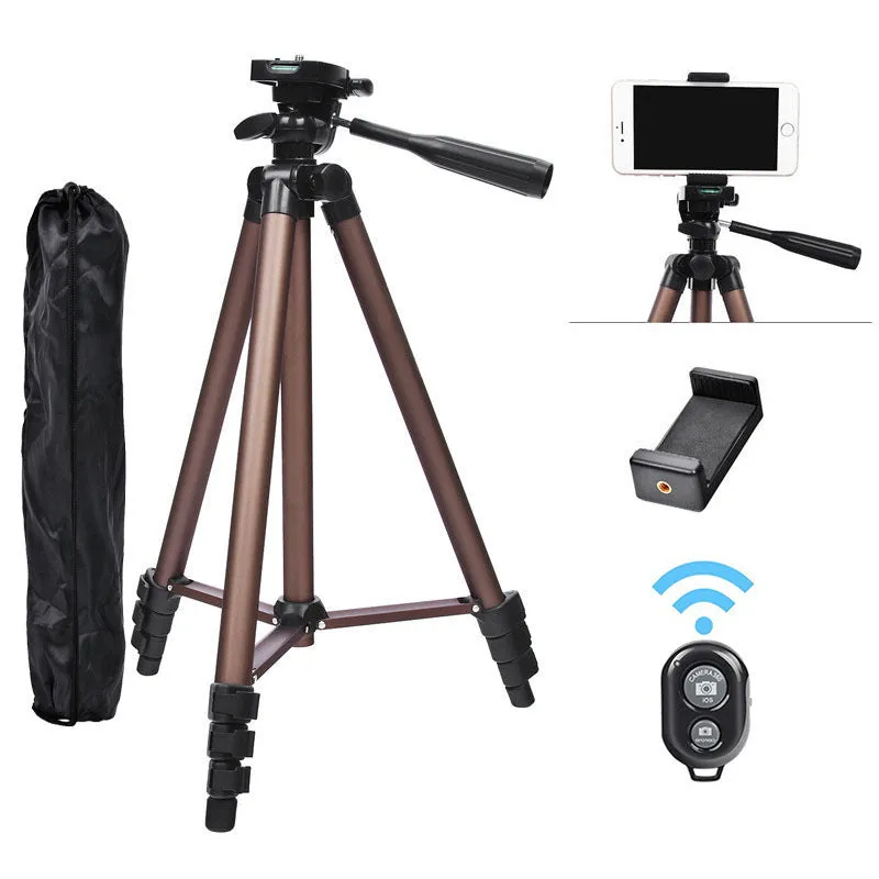 Aluminium camera tripod extended to 1.3m with hydraulic head, mobile phone holder, and Bluetooth remote on a table.