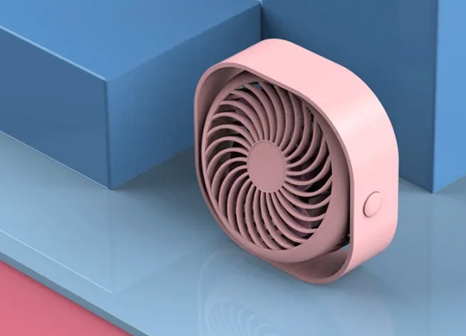 A small, modern USB desk fan in blue with a rotating head on a white desk.
