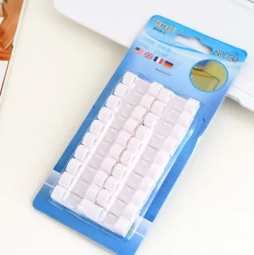 Self-adhesive wire cable organizer clips in multiple colours for cable bundling and management