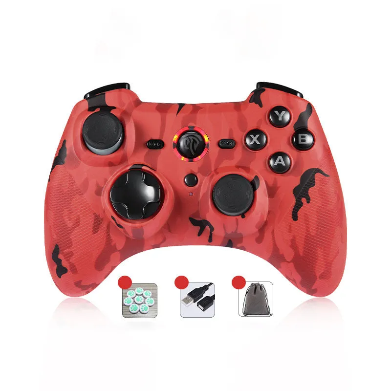 Black dual-mode wireless PC game controller with coloured buttons on a desk next to its storage bag and adapter.