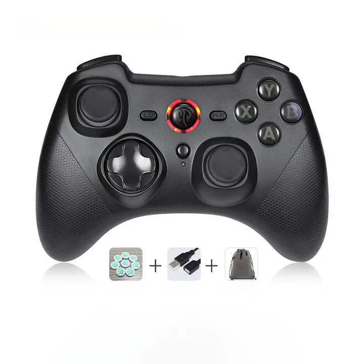 Black dual-mode wireless PC game controller with coloured buttons on a desk next to its storage bag and adapter.
