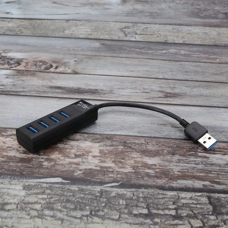 Black USB 3.0 hub with four ports, a 30cm cable, and LED status indicators next to each port.