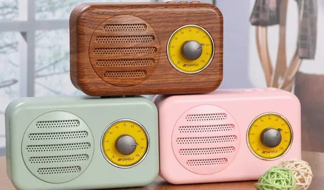 Portable Bluetooth mini speaker in vintage wood colour finish with micro USB cable.