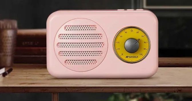 Portable Bluetooth mini speaker in vintage wood colour finish with micro USB cable.