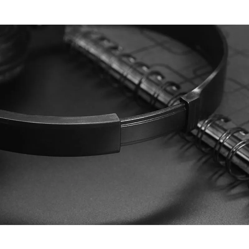 Black over-ear wired headphones with adjustable headband shown in folded and unfolded positions