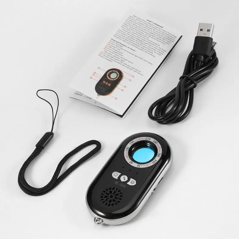 Compact black wireless signal detector with vibration sensor and alarm for anti-theft security.