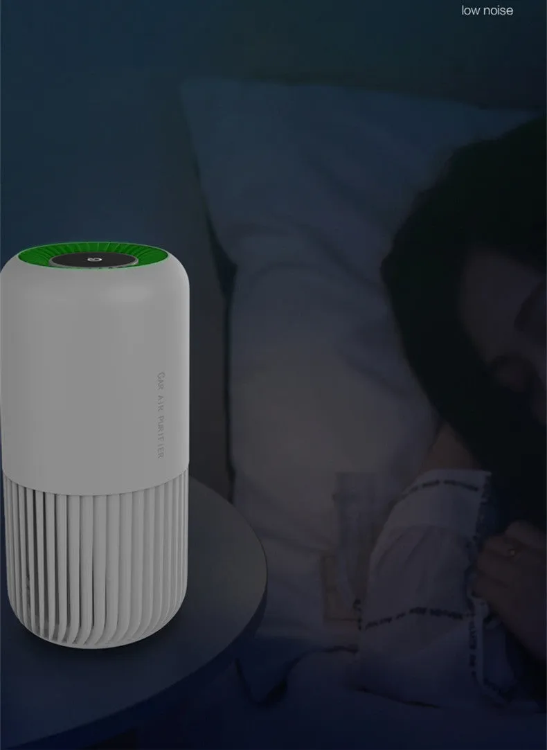 Compact black USB air purifier for car and desktop use with HEPA and UV filtration.