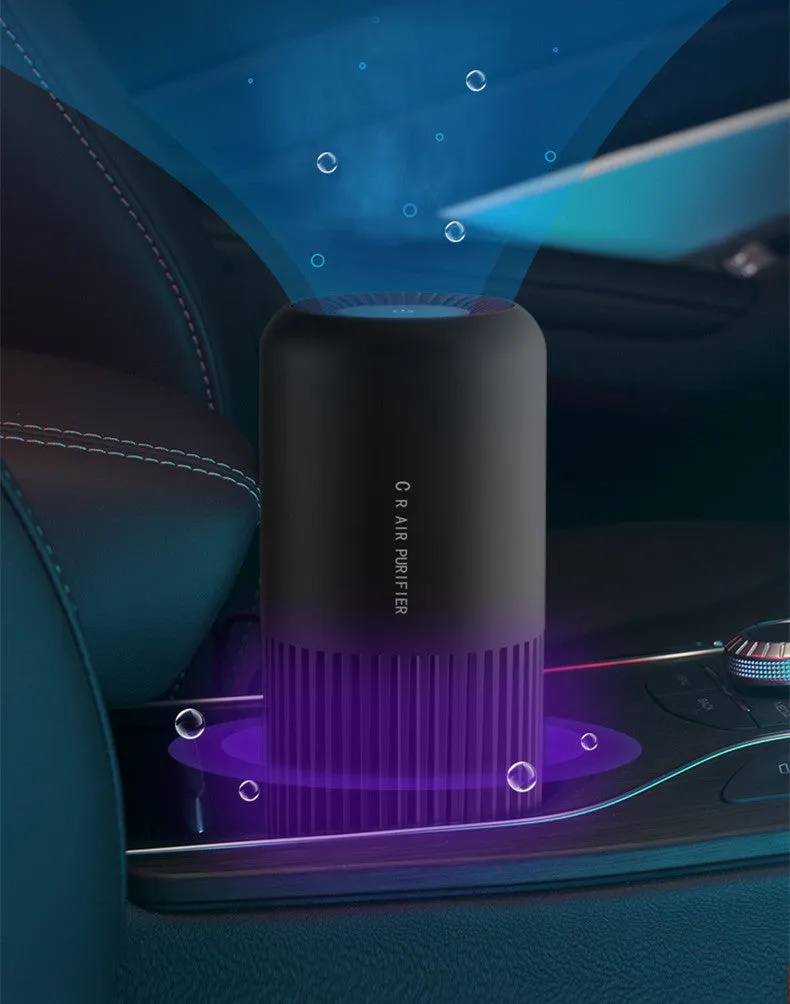 Compact black USB air purifier for car and desktop use with HEPA and UV filtration.