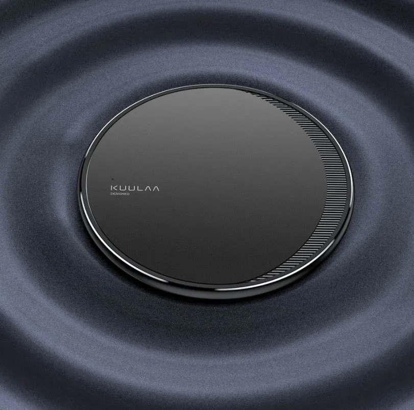 Black circular wireless disc charger for mobile phones with LED indicator light