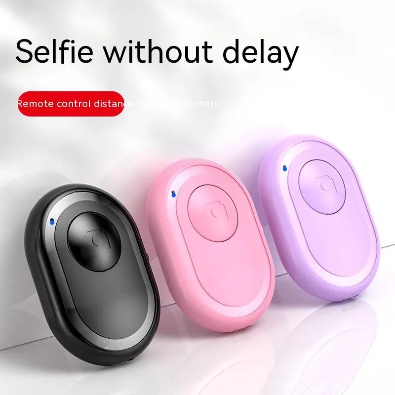 Wireless Bluetooth photo remote control in black, pink, or purple colours showing compact size