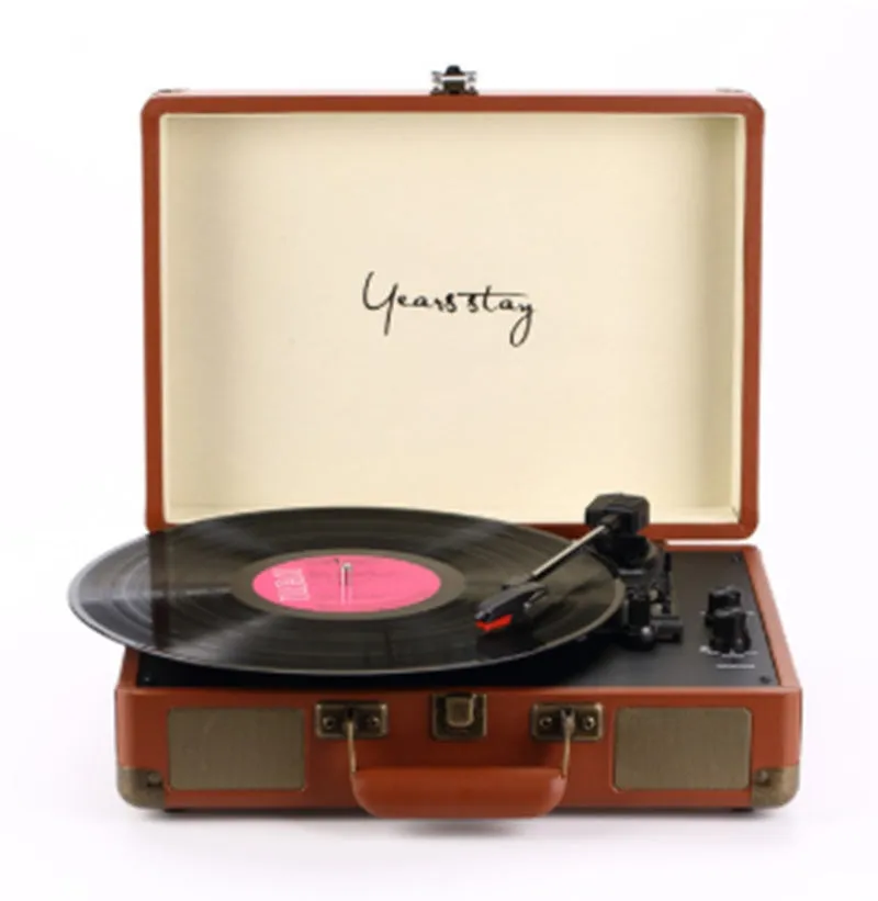 Portable Bluetooth vinyl turntable in a leather carrying case shown in multiple colour options