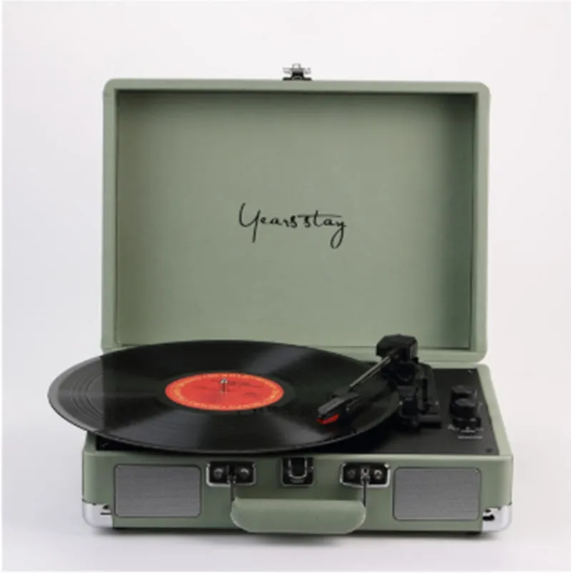 Portable Bluetooth vinyl turntable in a leather carrying case shown in multiple colour options