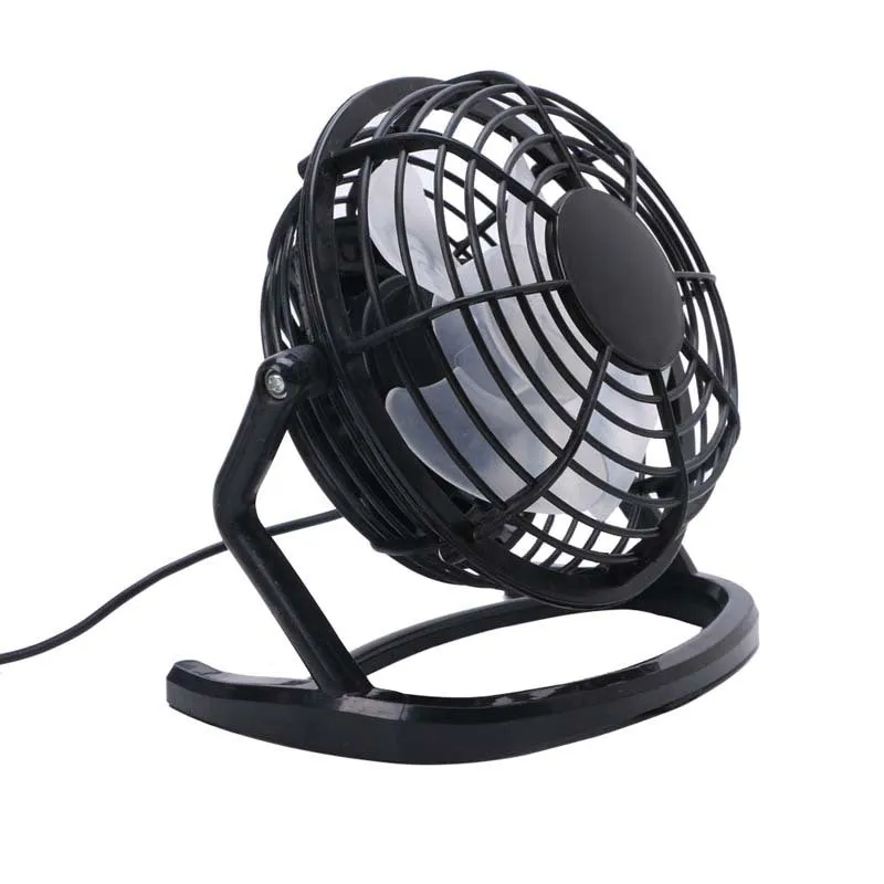 Small black adjustable USB desk fan with key switch on a wooden table.